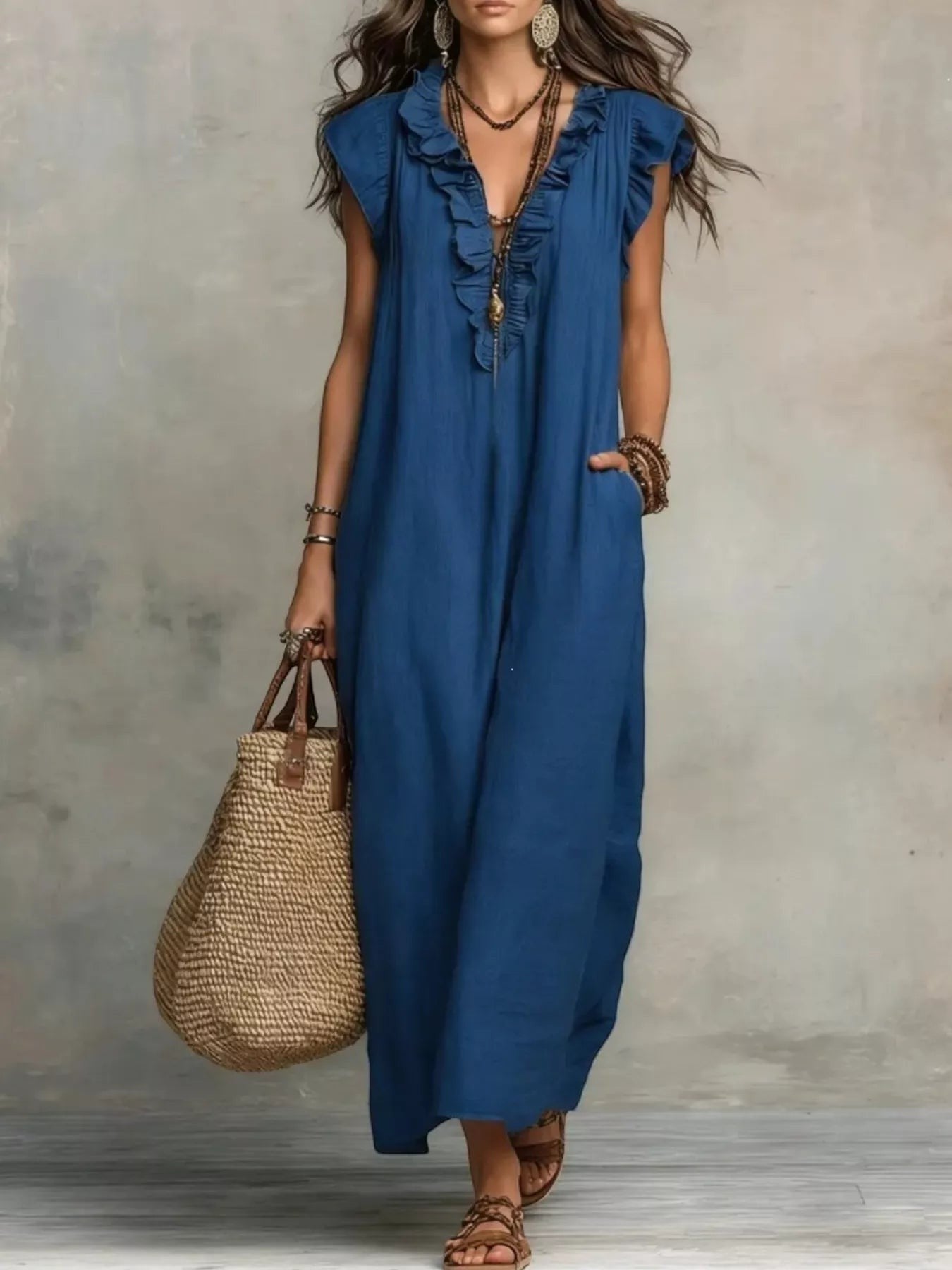 Health Hive blue ruffled V-neck maxi dress with cap sleeves and pockets, styled with a straw tote bag.