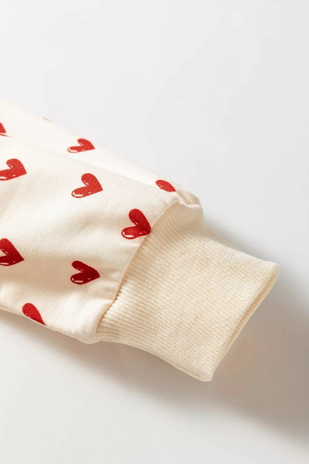 Health Hive long sleeve sweatshirt in cream with red heart print and ribbed cuff detail