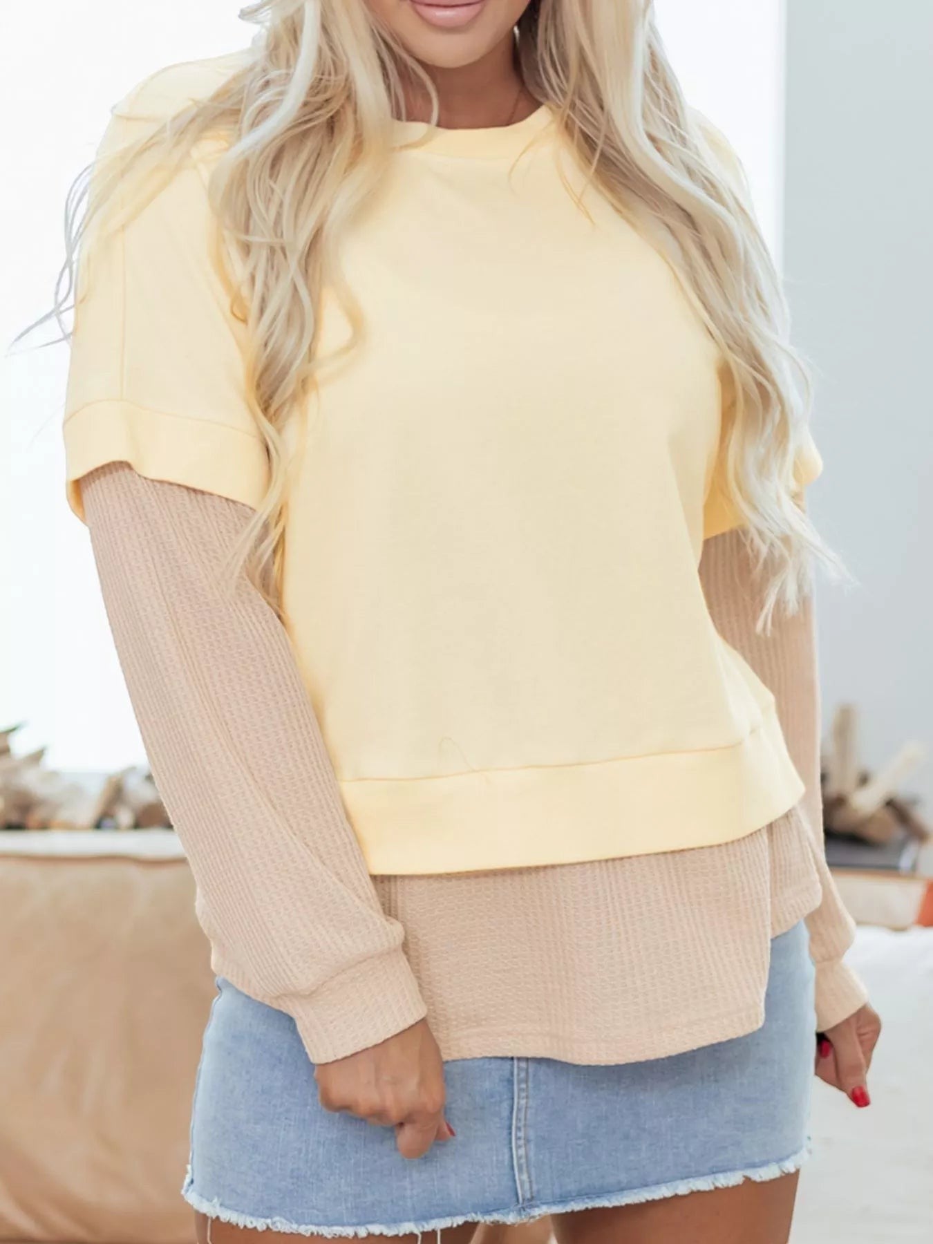 Health Hive faux two-piece patchwork sweatshirt in pastel yellow and beige with a round neck and waffle knit sleeves