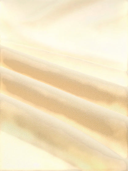 Close-up of soft beige polyester and cotton blend fabric from a Health Hive sweatshirt showing texture and folds