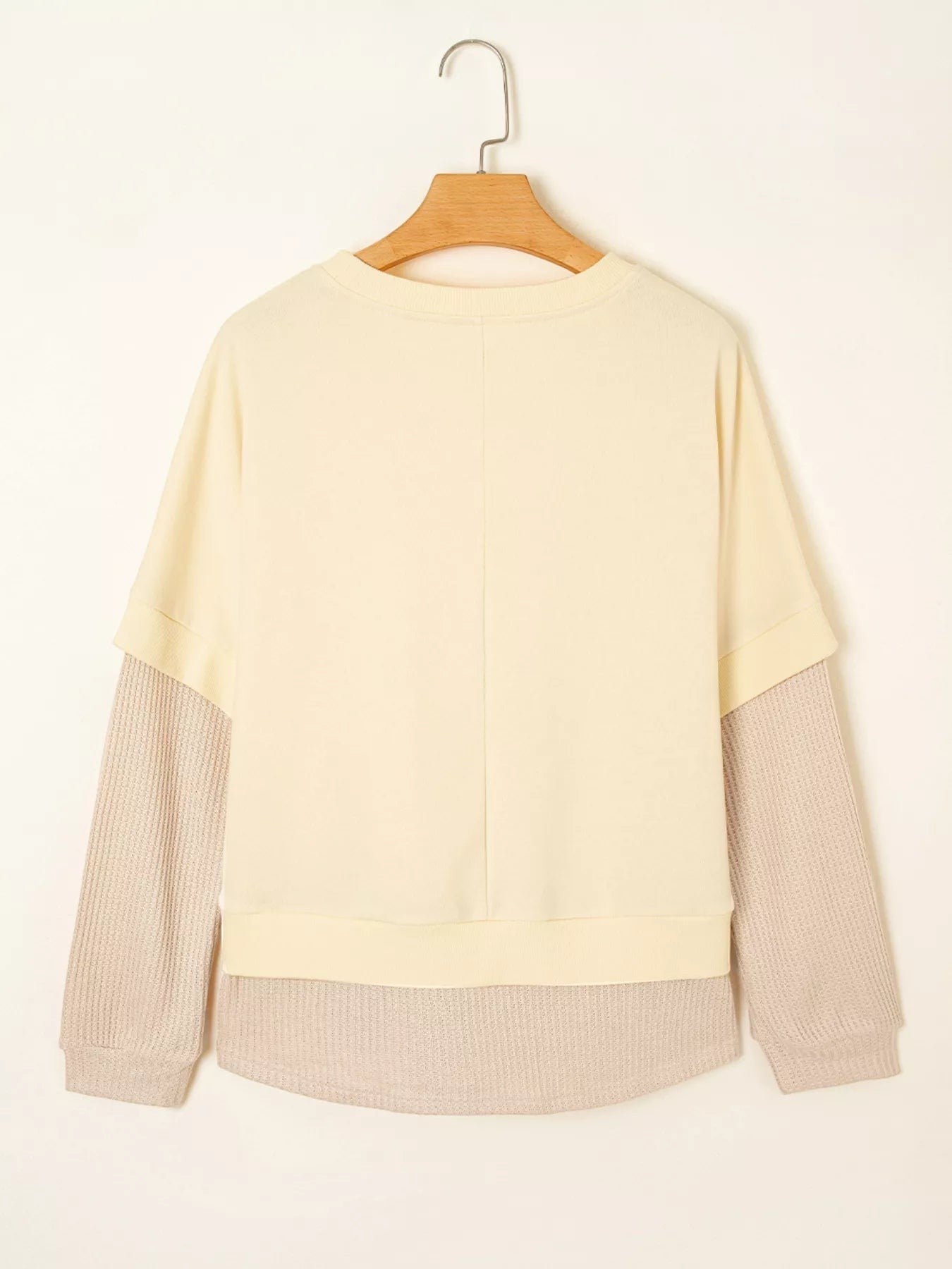 Health Hive 2-in-1 faux two-piece patchwork sweatshirt in cream and beige with a round neck and long sleeves.