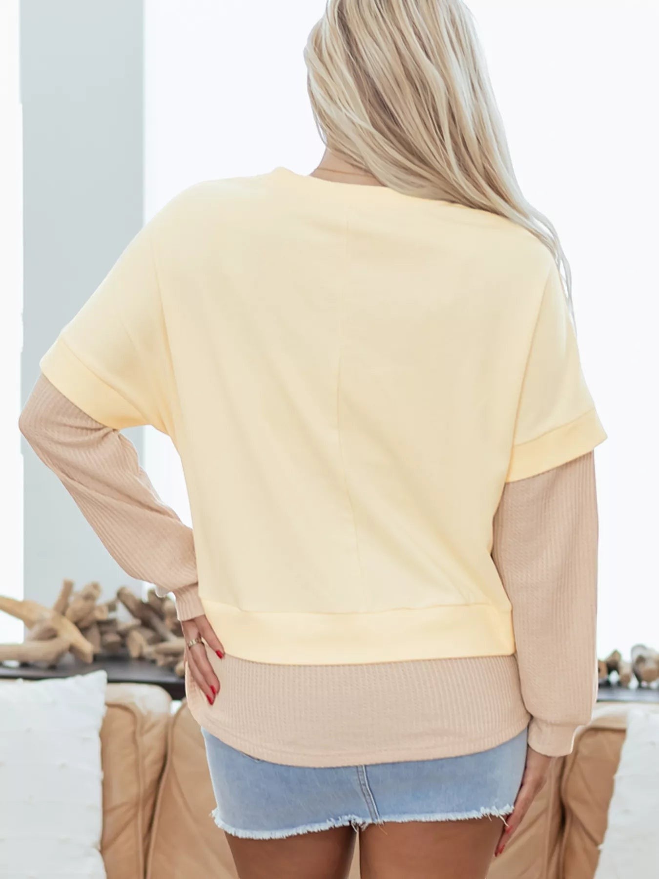 Health Hive faux two-piece patchwork sweatshirt in pale yellow and beige with a round neck and long sleeves.